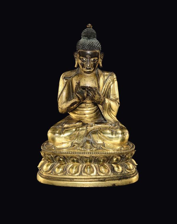 A gilt bronze figure of Sakyamuni on a double lotus flower, China, Ming Dynasty, 17th century