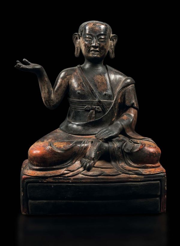 A rare painted pottery figure of seated Luohan, China, Qing Dynasty, 18th century