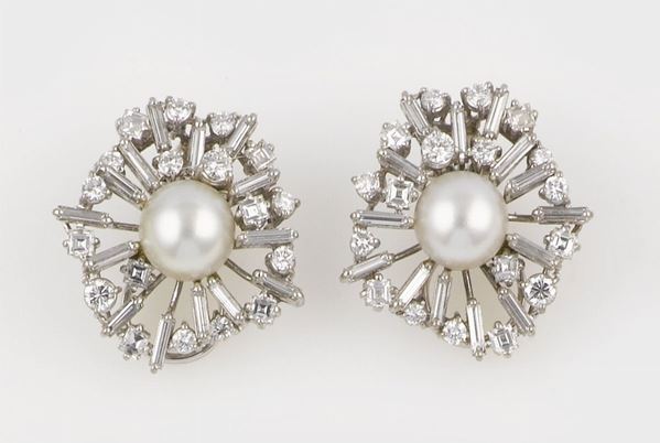 A pair of diamond and pearls earrings