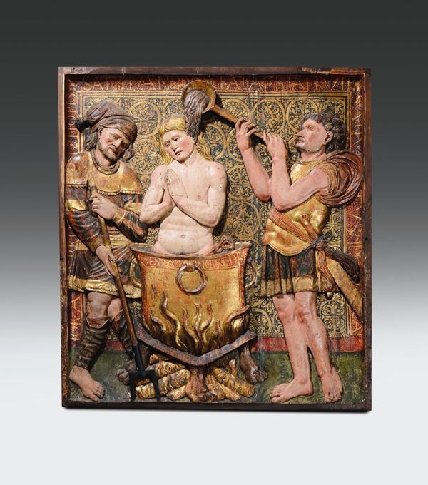Importante rilievo in legno policromo e dorato raffigurante scena con il martirio di San Giovanni Evangelista,  [..]