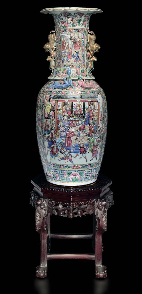 A large polychrome enamelled porcelain vase depicting court life scenes within reserves on a wooden stand with marble top, China, Canton, Qing Dynasty, 19th century