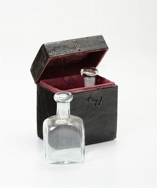 A lot composed of a silver oil jug and a glass and silver liqueur set, 19th century