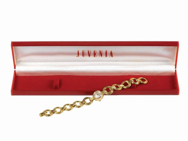 JUVENIA, case No. 647227, 18K yellow gold lady's wristwatch with a gold bracelet. Accompanied by the original box and Guarantee