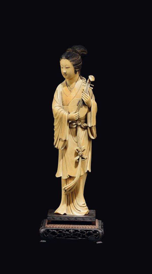 A carved ivory figure of playing Guanyin, China, early 20th century
