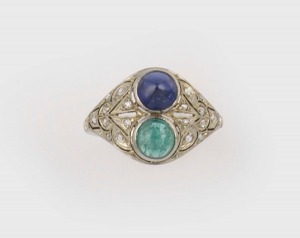 An emerald and sapphire ring