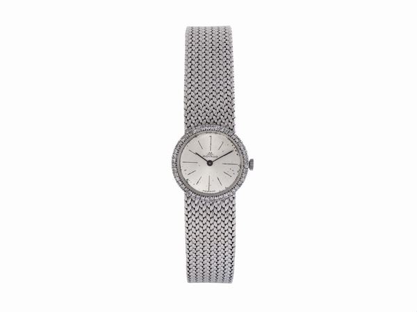 MOVADO, 18K lady's wristwatch with diamonds and an 18K white gold bracelet.  Made circa 1960