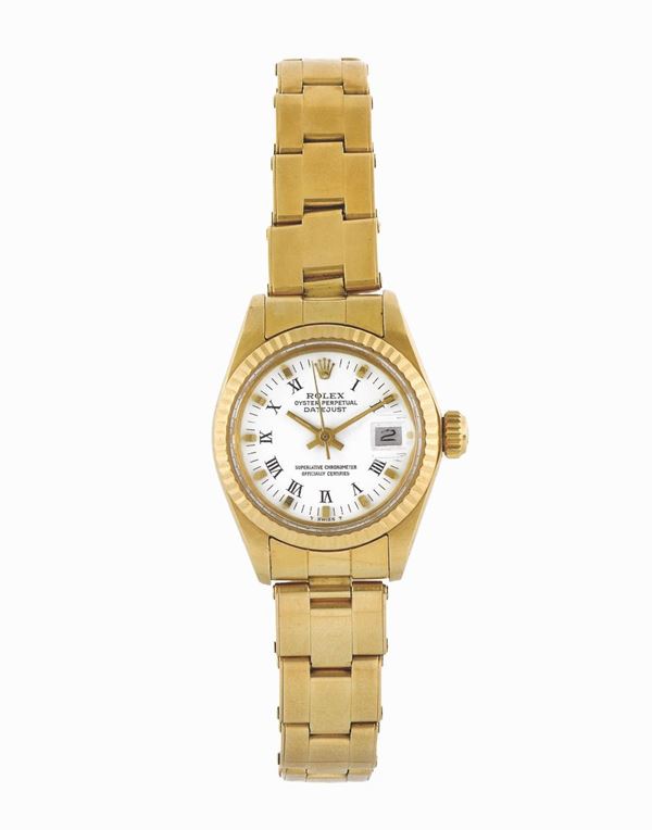 ROLEX, Oyster Perpetual, Datejust, Superlative Chronometer, Officially Certified, case No. 5933064 , Ref. 6917,  center seconds, self-winding, water resistant, 18K yellow gold lady's  wristwatch with date and  an 18K yellow gold Rolex Oyster  bracelet with deployant clasp.Accompanied by the original box. Made circa 1978.