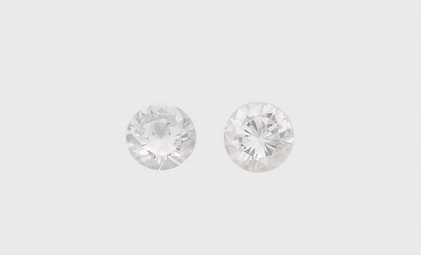A pair of unmounted diamond weighing 1,06 and 1,02 carats. R.A.G. reports