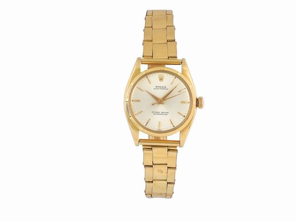 ROLEX, Oyster Perpetual, Officially Certified Chronometer, case No. 19743, Ref.6298/ 6299, tonneau-shaped, center-seconds, self-winding, water-resistant, 18K yellow gold wristwatch with  an 18K yellow gold riveted elastic  bracelet. Made circa 1950