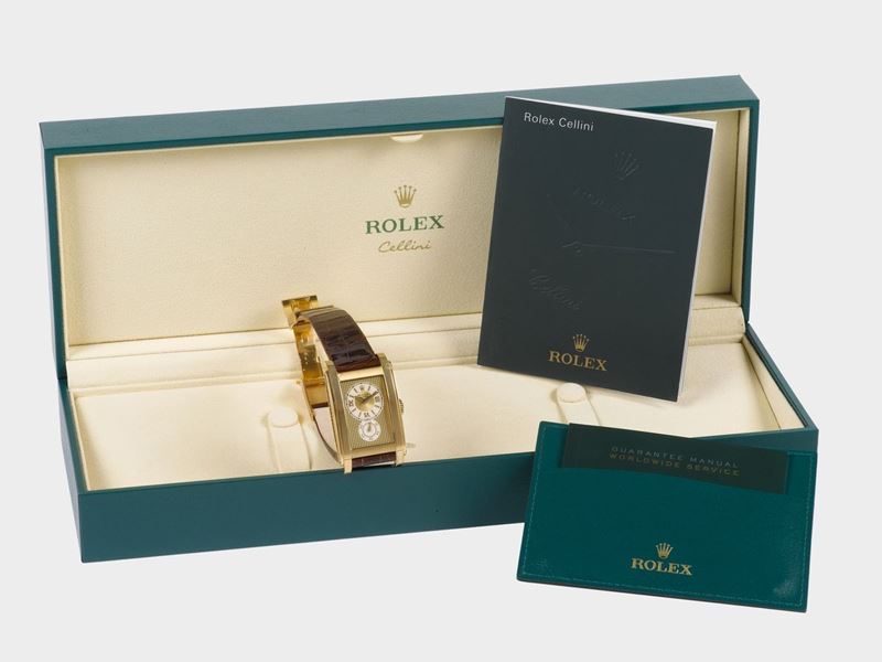 ROLEX, Cellini, Prince, case No. D781819, Ref. 5440/8, fine, large, aerofoil shaped, 18K yellow gold  wristwatch with an 18K yellow gold Rolex double deployant clasp. Accompanied by original fitted box, warranty (now void) and booklets. Made circa 2005  - Auction Watches and Pocket Watches - Cambi Casa d'Aste