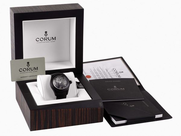 CORUM, BLACK  BUBBLE,  Ref. 08005, No. 099, unusual, center seconds, self-winding, water-resistant, curved, stainless steel and PVD coated self-winding wristwatch with date, thick domed crystal creating a lens effect, and a stainless steel and PVD coated Corum buckle.  Accompanied by a fitted box and Certificate. Made circa 2000's in a limited edition of 350 pieces