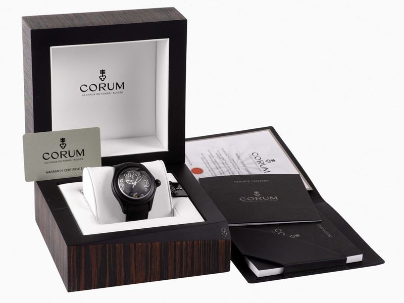 CORUM, BLACK  BUBBLE,  Ref. 08005, No. 099, unusual, center seconds, self-winding, water-resistant, curved, stainless steel and PVD coated self-winding wristwatch with date, thick domed crystal creating a lens effect, and a stainless steel and PVD coated Corum buckle.  Accompanied by a fitted box and Certificate. Made circa 2000's in a limited edition of 350 pieces  - Auction Watches and Pocket Watches - Cambi Casa d'Aste