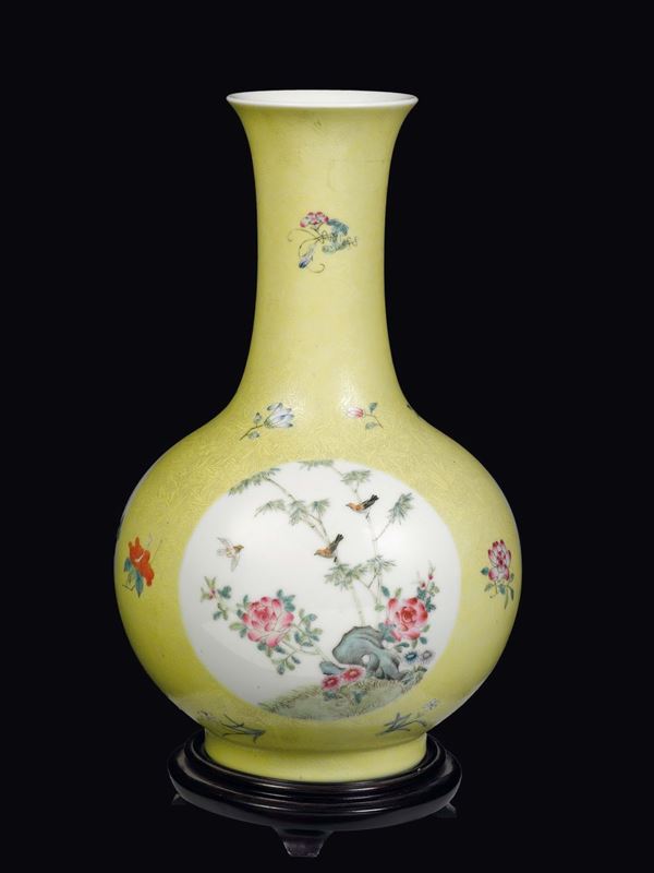 A yellow-ground porcelain vase with floral decoration within reserves, China, Qing Dynasty, early 20th century