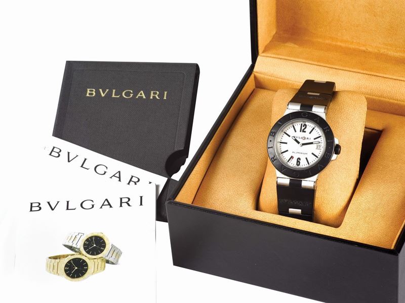 BULGARI, Automatic, Ref. AL 38 TA,  center seconds, self-winding, water-resistant,  alluminium and  PVD coated wristwatch with date,  alluminium and  rubber coated bracelet. Accompanied by a fitted box and Guarantee. Sold in 2006  - Auction Watches and Pocket Watches - Cambi Casa d'Aste