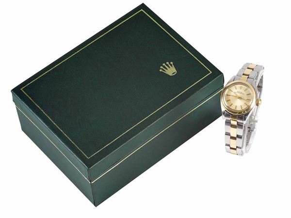 ROLEX, Oyster Perpetual, case No. 3882393, Ref. 6718,  center seconds, self-winding, water-resistant, stainless steel and gold lady's wristwatch with a stainless steel  and gold Rolex Oyster bracelet with deployant clasp. Accompanied by an original box. Made circa 1974