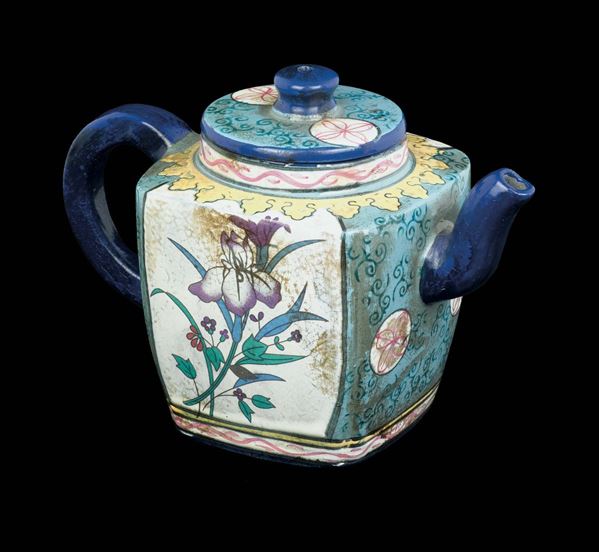 A rare Yixing glazed pottery teapot depicting flowers, China, Qing Dynasty, 19th century
