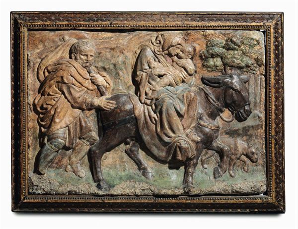 A polychrome stucco depicting the Flight into Egypt within a frame in carved and gilt wood. Italian Renaissance modeler (from Jacopo della Quercia), Bologna, second half of the 15th century