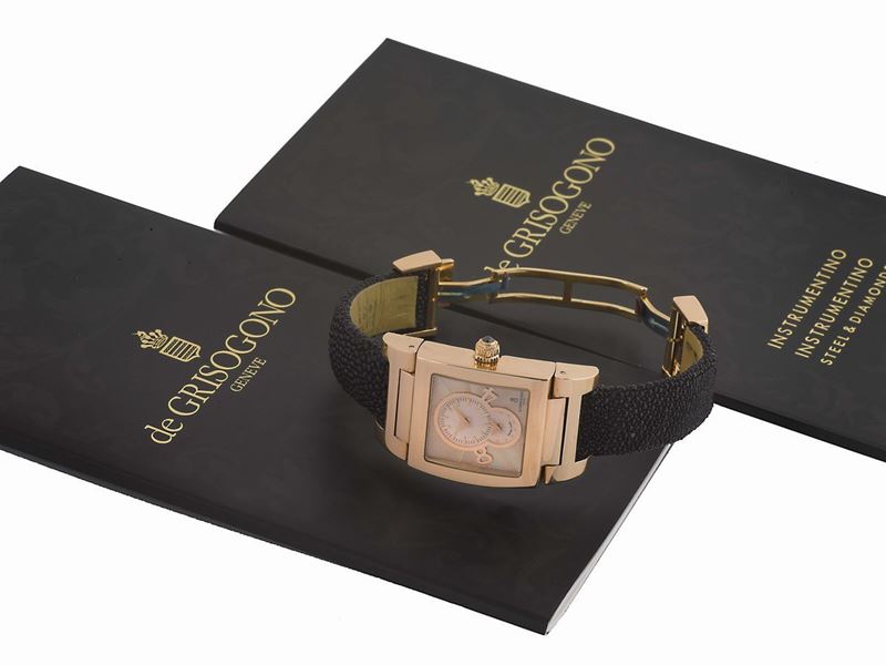 DE GRISOGONO, Genève, “Instrumentino”, case No. 016506, elegant, rectangular curved, two time zone, quartz, water-resistant, 18K pink gold  wristwatch with an  18K pink gold double deployant clasp. Accompanied by a De Grisogono fitted box, instruction booklet, and Guarantee.  - Auction Watches and Pocket Watches - Cambi Casa d'Aste