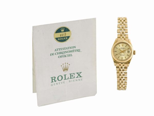 ROLEX, Oyster Perpetual, Datejust, Superlative Chronometer, Officially Certified, case No. 5665758, Ref. 6917, sold in  1978,  center seconds, self-winding, water resistant, 18K yellow gold lady's  wristwatch with date, and an 18K yellow gold Rolex Jubilee bracelet with deployant clasp. Accompanied by the original warranty