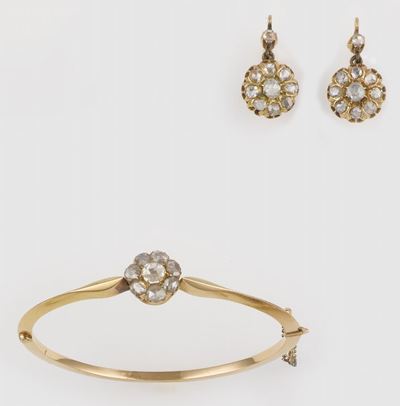 Parure Composta da Bangle ed Orecchini in Oro e Diamanti. XX Sec.