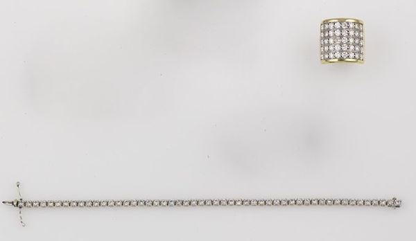 A group including a diamond line bracelet and a diamond ring