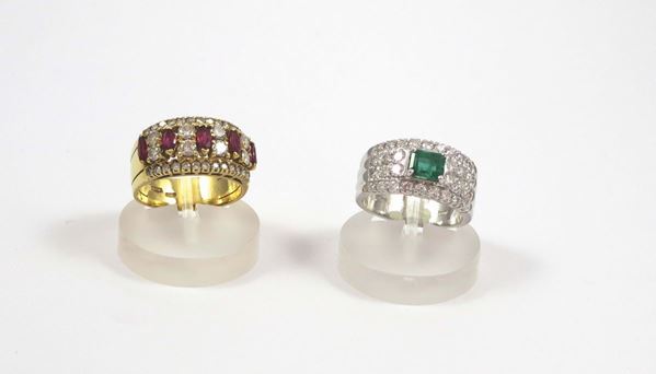 A group including a diamond and emerald ring and a diamond and ruby ring