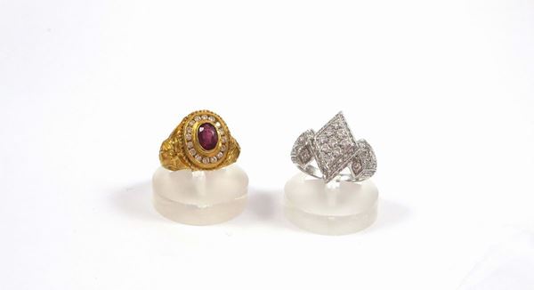 A group including a diamond ring and a diamond and ruby ring