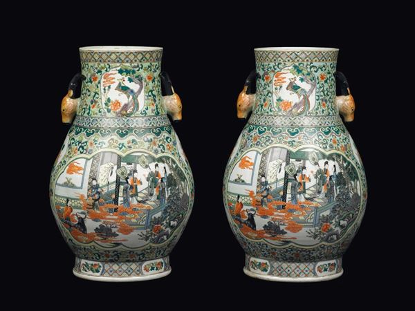 A pair of polychrome enamelled porcelain vases with deer-handles depicting court life scenes within reserves, China, Republic, 20th century