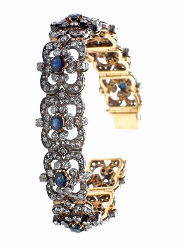 A diamond and sapphire bracelet. Mounted in gold and silver
