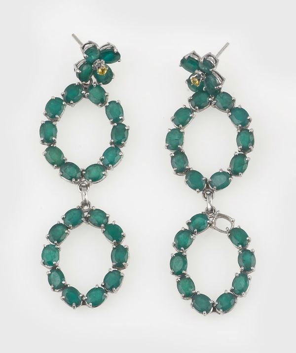 A pair of emerald pendent earrings