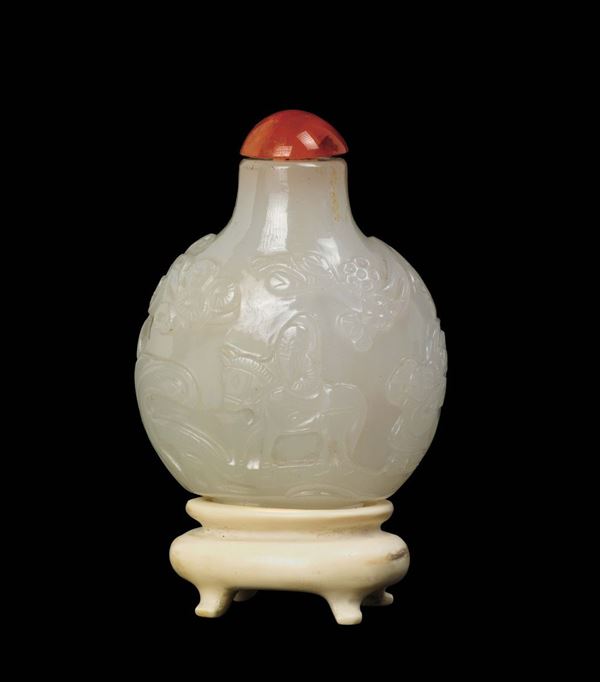 A white jade snuff bottle with ivory stand, China, Qing Dynasty, 19th century