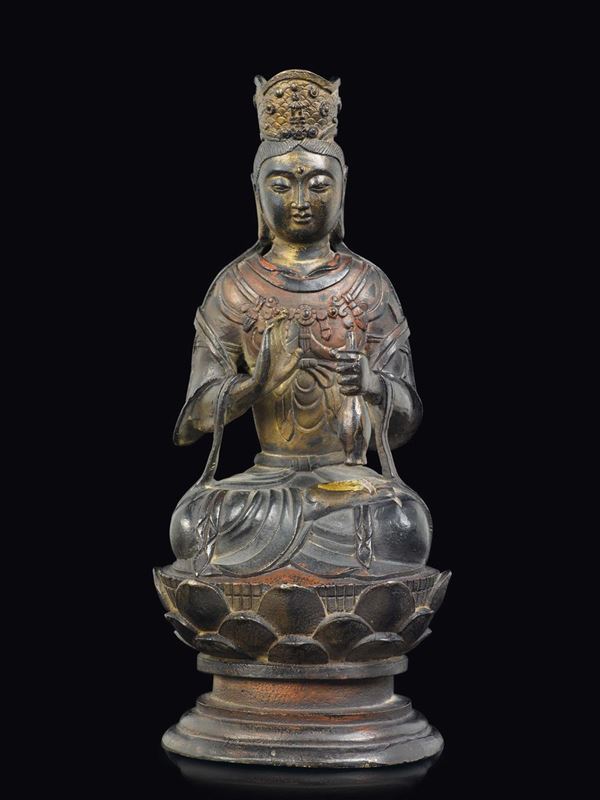 A bronze figure of crowned Guanyin seated on a lotus flower, China, Ming Dynasty, 17th century