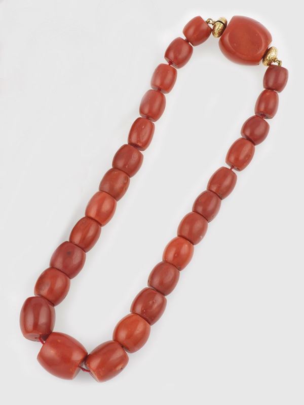 A coral and gold necklace