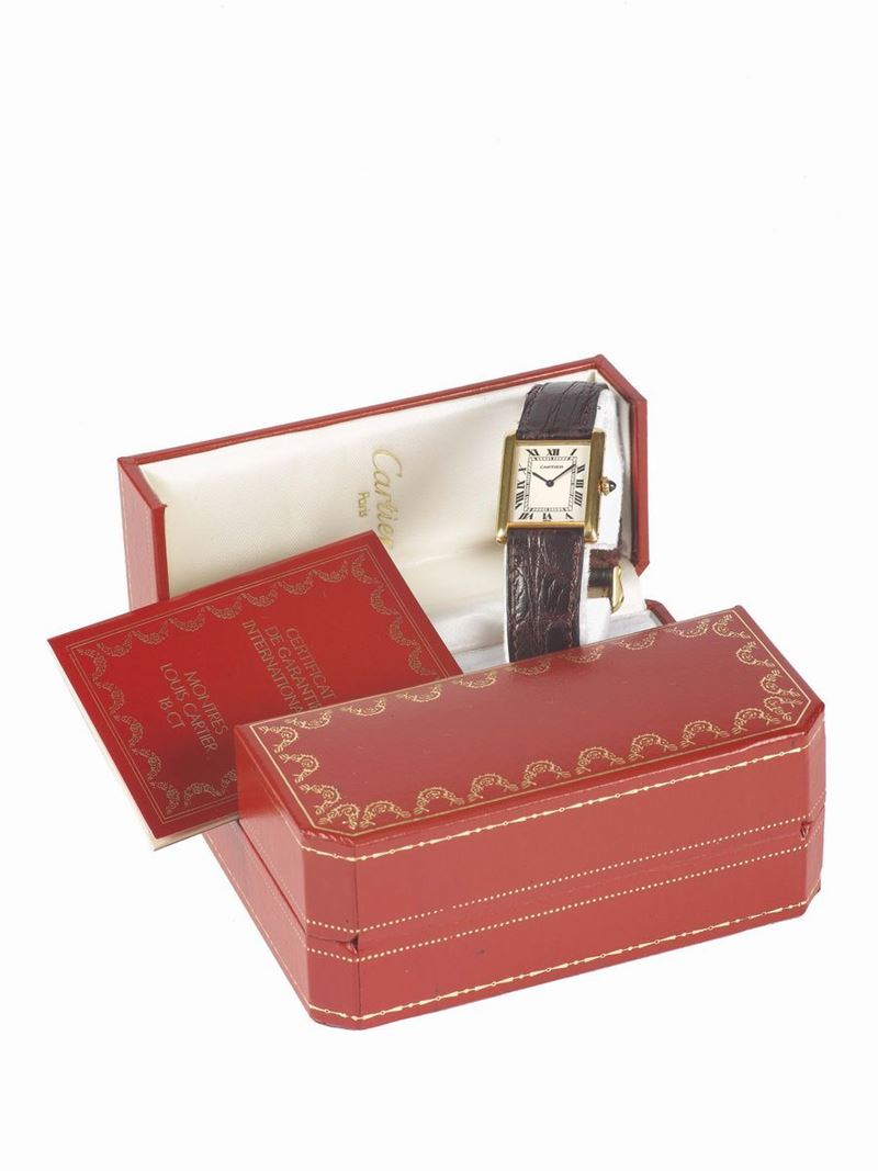 Cartier, Paris, Tank, case No. 960655020, elegant, rectangular, thin, 18K yellow gold lady's wristwatch. Accompanied by the original fitted Cartier box and Guarantee. Sold in the 1990's  - Auction Watches and Pocket Watches - Cambi Casa d'Aste