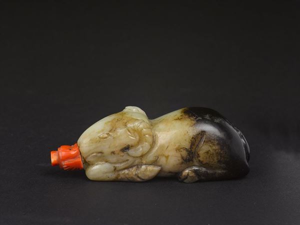 A yellow and russet jade ram snuff bottle, China, Ming Dynasty, 17th century