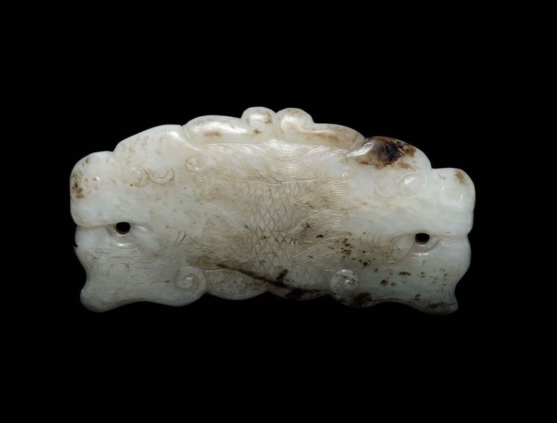 A white and russet jade belthook, China, Ming Dynasty, 16th century  - Auction Fine Chinese Works of Art - Cambi Casa d'Aste