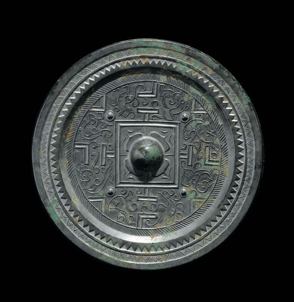 A bronze Bo Ju mirror with central boss, China, Han Dynasty (206 b.C-220 a.C.)
