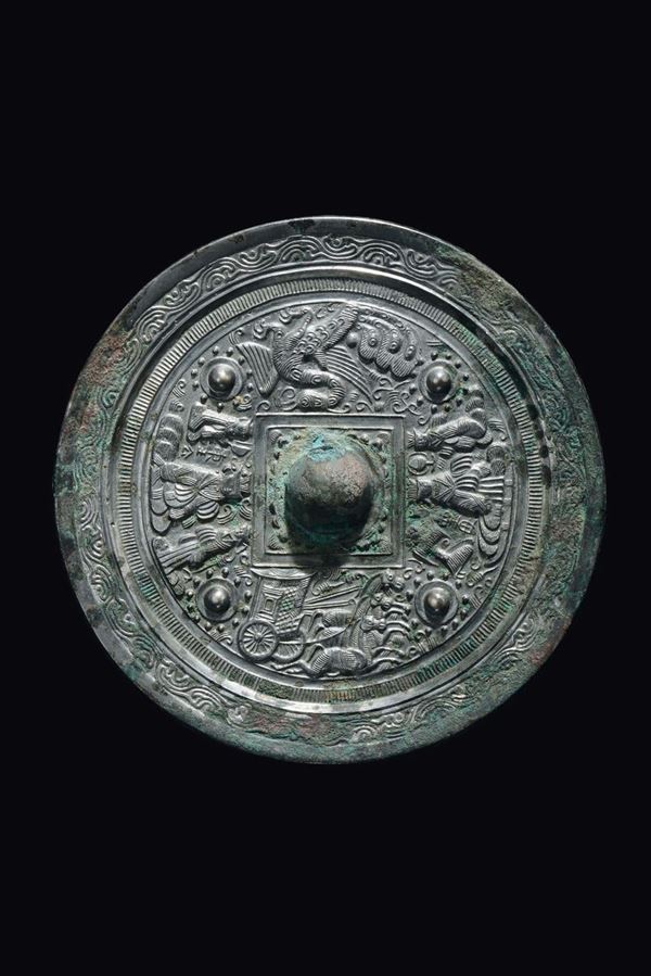 A bronze Bo Ju mirror with central boss, China, Han Dynasty (206 b.C-220 a.C.)