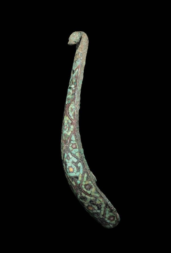 An embossed bronze belthook, China, Warrior States (481-221 b.C.)