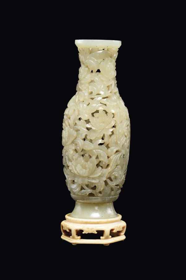 A rare white and russet fretworked jade vase, China, Qing Dynasty, Jiaqing Period (1727-1820)