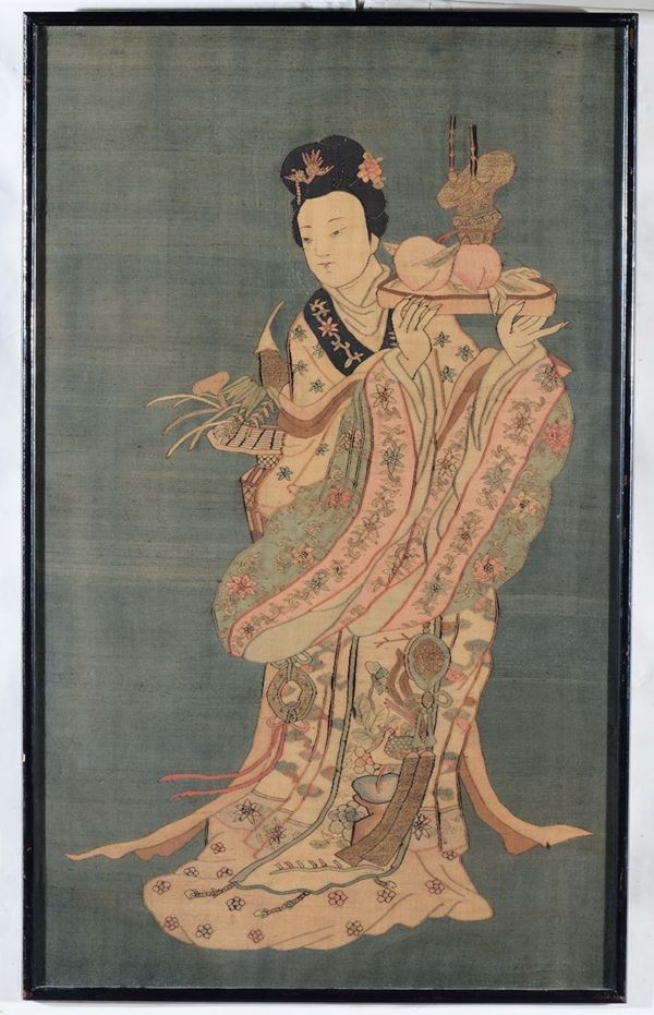 A silk blue-ground Kesi depicting Guanyin with tray, China, Qing Dynasty, 19th century