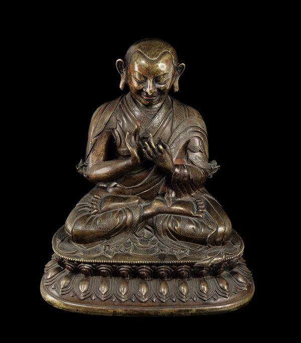 A large and important semi-gilt bronze figure of Lama seated on a double lotus flower, China, Qing Dynasty, Qianlong Period (1736-1795)