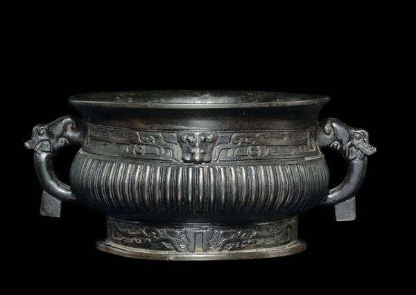A bronze handeled censer with a geometric archaic style motif, China, Ming Dynasty, 17th century