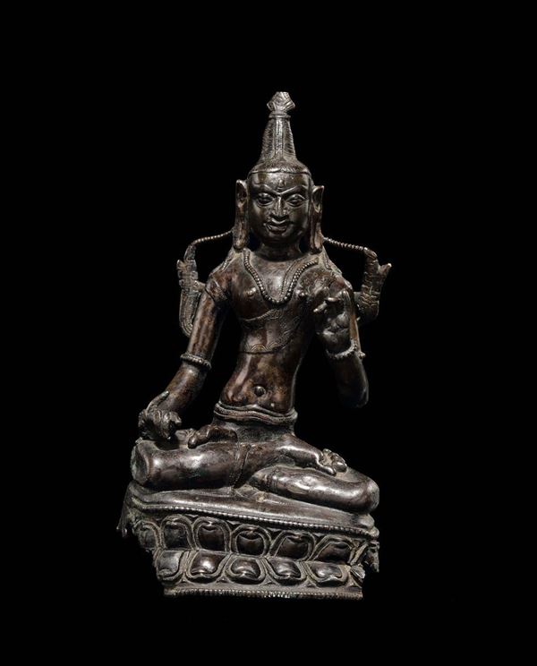A bronze deity on a double lotus flower, Tibet, 17th century
