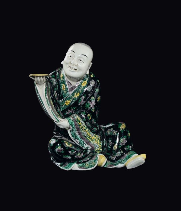 A Famille-Noir porcelain figure of seated dignitary, China, Qing Dynasty, 19th century