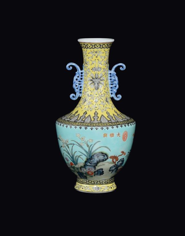 A polychrome enamelled porcelain double handled vase with naturalistic decoration, China, Republic, 20th century