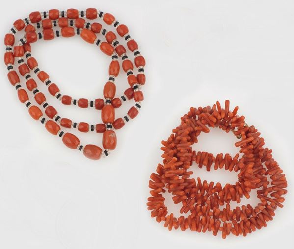 A coral necklace and a coral, onix and rock crystal necklace