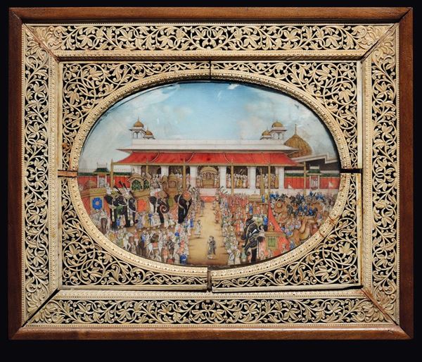 An ivory miniature depicting a royal worship on a fretworked frame, India, 19th century