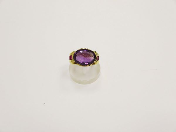 An amethyst and ruby ring