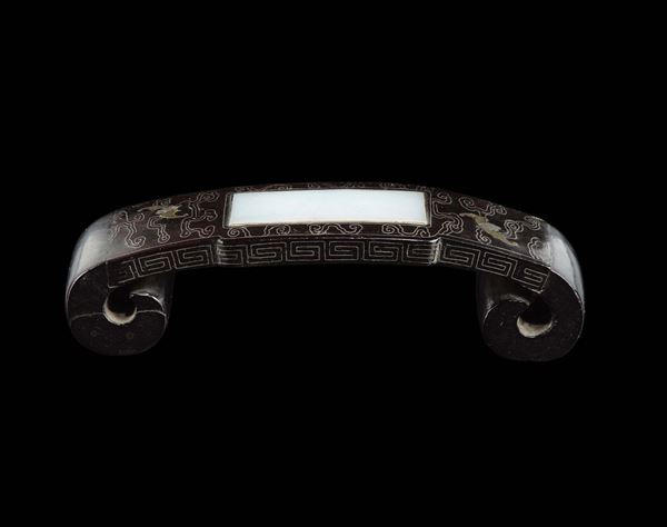A zitan wrist-rest with white jade plaque with silver inlays between bats, China, Qing Dynasty, 18th century